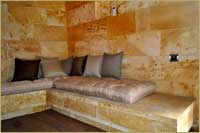 Superior Deluxe Stone Room Kuzey Honeymoon Room couch in Cave Hotel Cappadocia