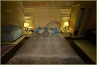 Superior Deluxe Cave Room Leda Honeymoon Room bed in Cave Hotel Cappadocia